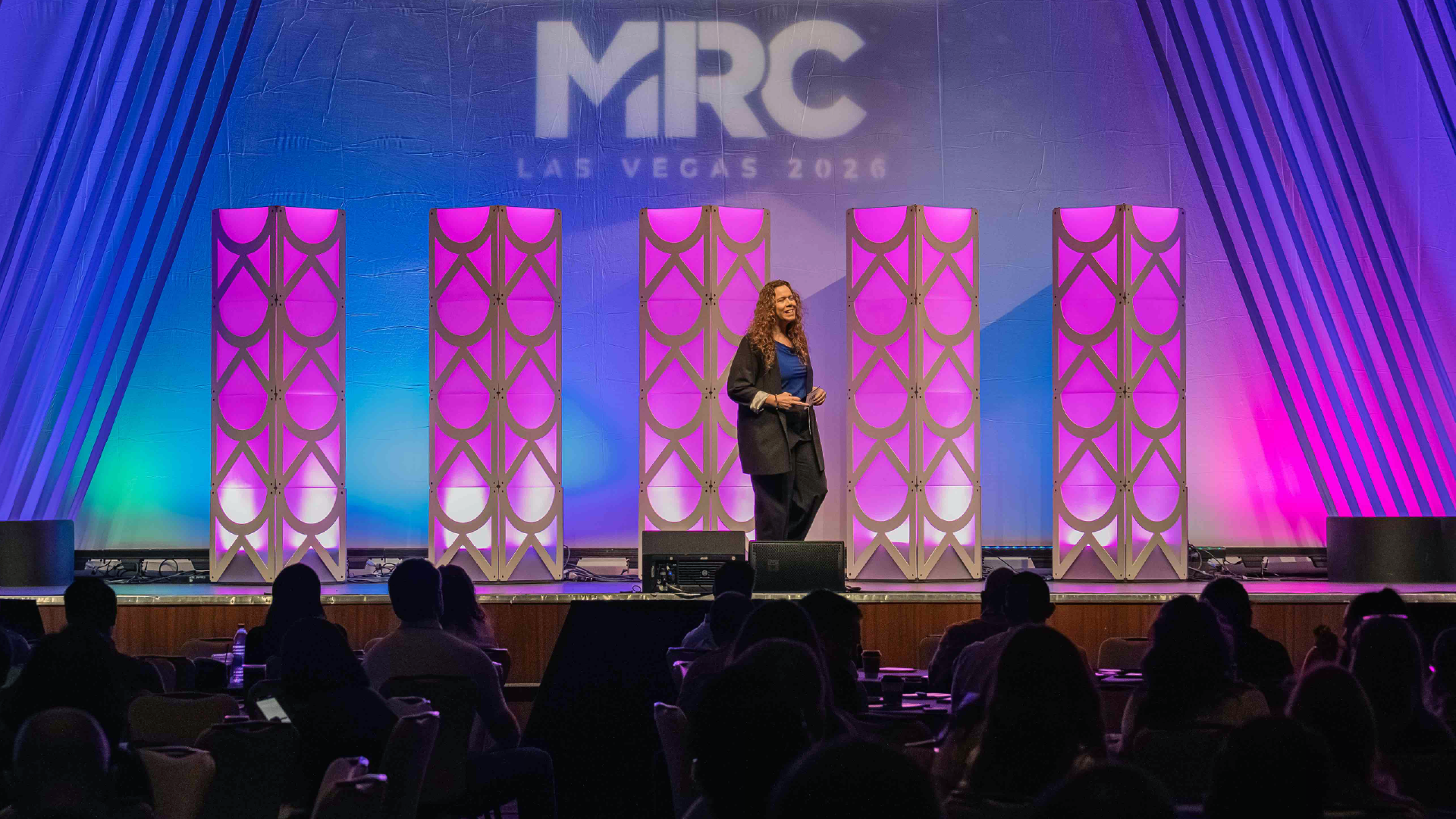 Speaker presenting on stage at MRC Las Vegas.