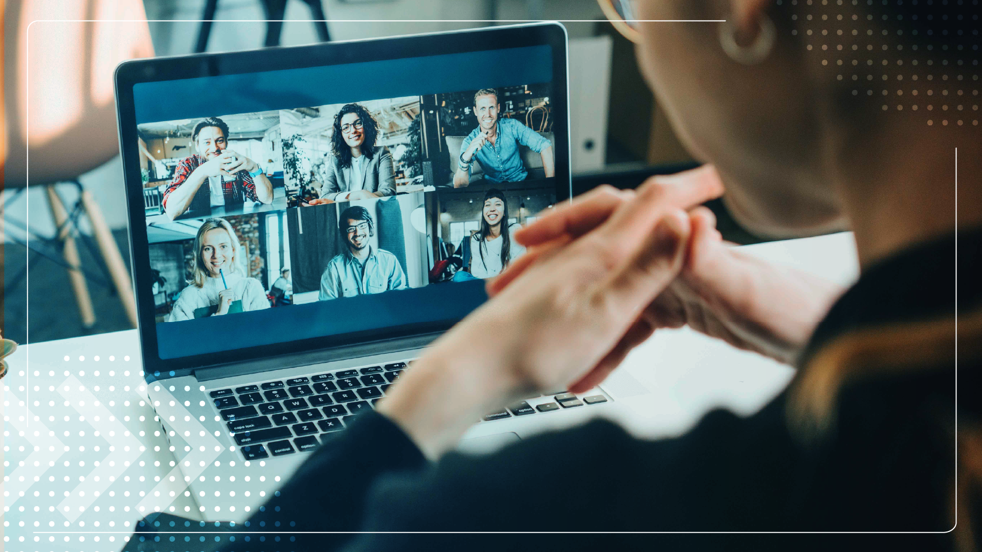 Person participating in a group video conference on a laptop.