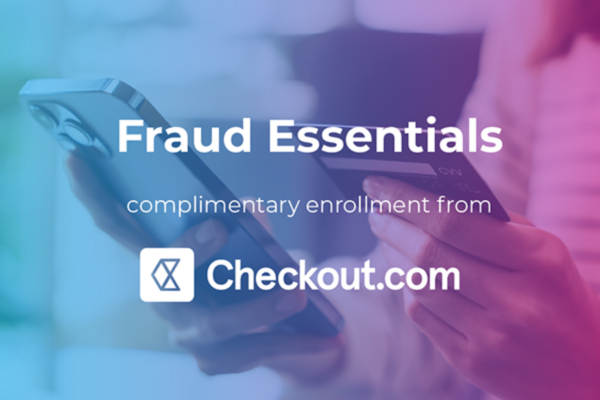 Promotional banner with a person holding a smartphone and credit card. Text reads: 'Fraud Essentials – complimentary enrollment from Checkout.com' with the Checkout.com logo.